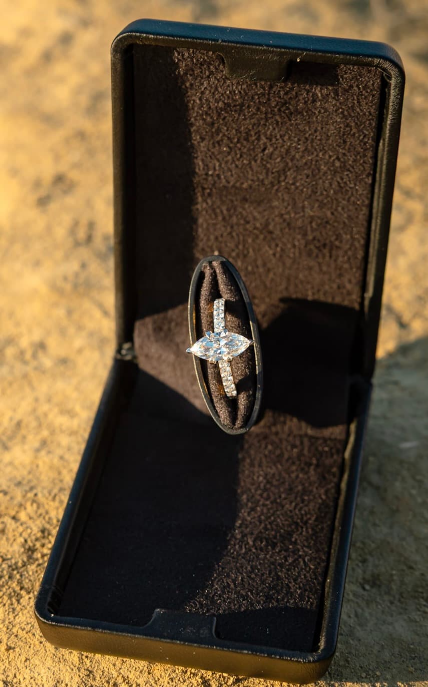 Marquise diamond engagement ring on a pavé band