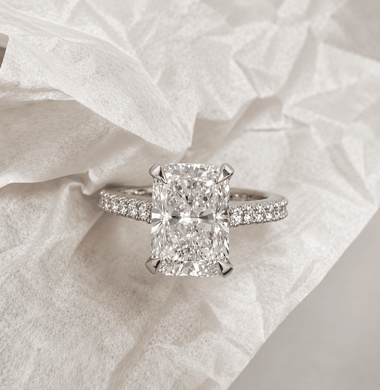 Diamond engagement ring on a pavé cathedral band